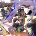 PAINTING THE TOWN - David Bolkins, 6, a first-grader at The New School in Fayetteville, helps to pai...