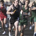 Bentonville’s Ben Nichols leads the final leg of the 3,200-meter relay Thursday during the Tiger Rel...