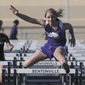 Fayetteville’s Cassidy Cunningham clears a hurdle Thursday at the Tiger Relays in Bentonville.