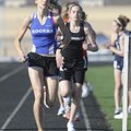 Rogers High’s Erica Owens leads the 3,200-meter relay Thursday during the Tiger Relays at Bentonvill...