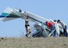 Madison County emergency responders look over the scene of a small airplane crash Thursday afternoon just east of the Huntsville airport runway. The pilot was killed in the crash when the plane went down in a field next to county road 5663. The pilot was the only person in the plane at the time of the crash.