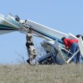 Madison County emergency responders look over the scene of a small airplane crash Thursday afternoon...