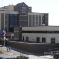NORTHWEST HEALTH SYSTEM - Pedestrians walk to and from the main entrance Friday of the Northwest Med...
