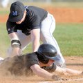  Bentonville’s Ryan Harralston dives for third base too late to avoid the tag by Miami’s Jordan Hess...