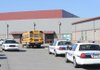 NOTHING FOUND - Several Fayetteville Police Department vehicles park along the entrance to Holt Middle School on Friday after a report of a student in possession of a weapon forced the lockdown at the school. No weapon was reportedly recovered in the incident.