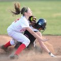  Farmington shortstop Michaela Larabee, left, collides with Springdale’s Laura Worthen after tagging...