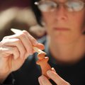  Tiffiney Voorhees of Fayetteville sculpts a goddess figurine March 6 during the Creating Clay Godde...