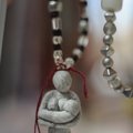  A goddess figurine necklace hangs on display during a figurine-making workshop March 6 at the Godde...