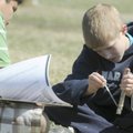 WEATHER GADGET - Anthony Newman, 13, right, wets the end of a thermometer as part of a sling psychom...