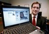 In this Oct. 13, 2009, file photo, Assistant U.S. Attorney Michael Scoville displays part of the Facebook page, and an enlarged profile photo, of fugitive Maxi Sopo in Seattle. The Feds are on Facebook. And MySpace, LinkedIn and Twitter, too. U.S. law enforcement agents are following the rest of the Internet world into popular social-networking services, going undercover with false online profiles to communicate with suspects and gather private information, according to an internal Justice Department document that offers a tantalizing glimpse of issues related to privacy and crime fighting. 