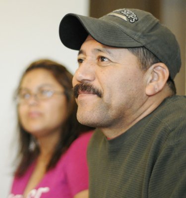 
                               
                                  Photo by Sarah Bentham&mdash;
                               
                           
                           Miguel and Maricela Hernandez of Springdale are smiling despite the 13-month ordeal they faced trying to get their home mortgage modified. Bank of America recently sent the them a $5,000 check as part of an apology, and the family hopes to return to their home by summer.