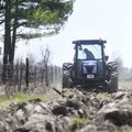 Chuck Harris with the Springdale Public Works Department tills a plot of land Friday on McCollough D...