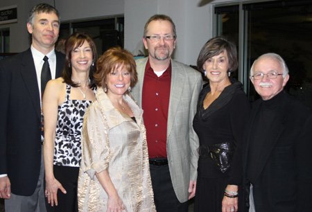 
                           Greg Blahut and Walnut Farm Montessori School Director Judy Dunn, from left, visit with Jennifer and Tom Stallbaumer and Nancy and volunteer auctioneer Dick Trammel at Art Experience.

