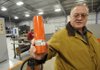 Joe Fancher, general manager of Brunner & Lay Inc. in Springdale holds a coupler made at the Springdale facility.
