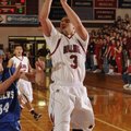  Springdale High’s Shelton Baird, right, shoots over Rogers High’s Casey Caton during the first half...