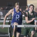 Rogers High’s Anthony Bazz competes Thursday in the hurdles at the Tiger Relays in Bentonville.
