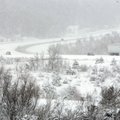 Snow slicks roads in the Fayetteville area Sunday morning.