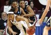 UALR's Asriel Rolfe (left) and Marian Kursh defend on Georgia Tech's Alex Montgomery in Norman, Okla., during their game Sunday in the first round of the NCAA Women's Basketball Championship.
