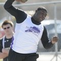 Fayetteville’s Demetrius Dean competes Thursday in the shot put at the Tiger Relays in Bentonville.