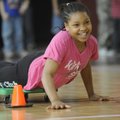 Mystique Taylor, 10, of Fayetteville competes in an obstacle course race Tuesday at the Yvonne Richa...