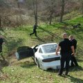 Benton County Sheriff’s deputies D. Winn and Corey Coggin, deputies first class, watch the car and s...