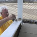 John Harrington, with the Bentonville Parks and Recreation Department, paints a new score booth Wedn...