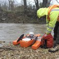 Blake Whittle, a student hydrotech with the U.S. Geological Survey, uses an acoustic Doppler velocim...