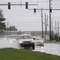 FOGGY DRIVE - Cars travel north on Arkansas 265 in Springdale through pools of water left after heav...