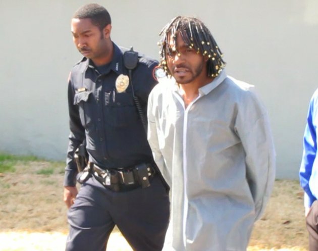 police-escort-shooting-suspect-harry-porter-from-the-downtown-detective-office-and-into-a-patrol-car-bound-for-the-pulaski-county-detention-center
