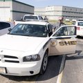 Benton County Sheriff’s Deputy Paul Bevilacqua 
climbs into a Dodge Charger on Friday to go on patr...