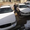 PATROL OPTIONS - Fayetteville police Cpl. Chris Clardy exits his patrol car, a Ford Crown Victoria, ...