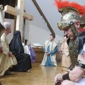 GOOD FRIDAY GRACE’ - Jary Griffith, portraying a Roman centurion, bows at the cross Thursday during ...