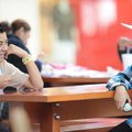 Miguel Labra, left, and Jose Rodriguez, both 13-year-olds from Springdale, laugh Friday while using ...