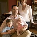 Chad Sullivan, the chairman of this year’s Komen Ozark Race for the Cure, sits with his son, Noah, l...