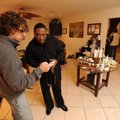 THINKING OUTSIDE THE BOX - Artist and photographer Tony Boyd, right, checks out photographs taken by...