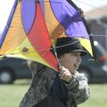  FLIGHTS OF FANCY - Savanna Harrison, 11, of Berryville, holds a kite in the wind Saturday, during t...