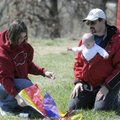  Chris Adkins, from left, Dave Adkins and Lorelai Adkins, 6 months, prepare to fly a kite Saturday d...