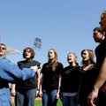  Members of the Benton County School of the Arts’ show choir perform the national anthem Saturday at...