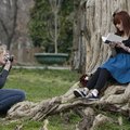 Claudia Hall, 14, focuses her camera while taking a portrait of Haley Zega,15, both of Fayetteville...