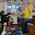 Margo Acuff reads a book Friday at Turnbow Elementary School that her kindergarten students created.