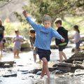 Joshua Lasse, 9, of Fayetteville nearly loses his balance while playing with friends on Monday in Ni...
