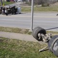 Johnson police Sgt. Bob Selph, right, and Johnson firefighters work the scene of an accident Monday ...