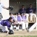 Fayetteville’s Conner Roberts reaches to tag Springdale High’s Matt McDonald at home plate as the um...