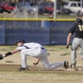 Springdale Har-Ber senior Devin Cook, left, fields a low throw to first base as Bentonville sophomor...
