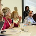 Kathy Grisham, second from left, executive director of the Community Clinic talks Wednesday as, from...
