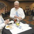 RAISING AWARENESS - Jackie Stout, left, and Rogers Stout, both volunteers at the Northwest Arkansas ...