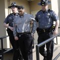 Erickson Dimas-Martinez is escorted Thursday from the Benton County Courthouse Annex in Bentonville ...