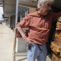 CHIEF GREETER - Danny Bowen of Fayetteville pauses Thursday after returning Chief Redfeather to his ...