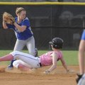 Bentonville’s Alex Cooper slides into second base as Rogers High’s Kayla Merritt tries to turn a dou...