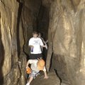Visitors make their way through Devil’s Den Cave in this 2005 photo. Devil’s Den Cave and Devil’s Ic...